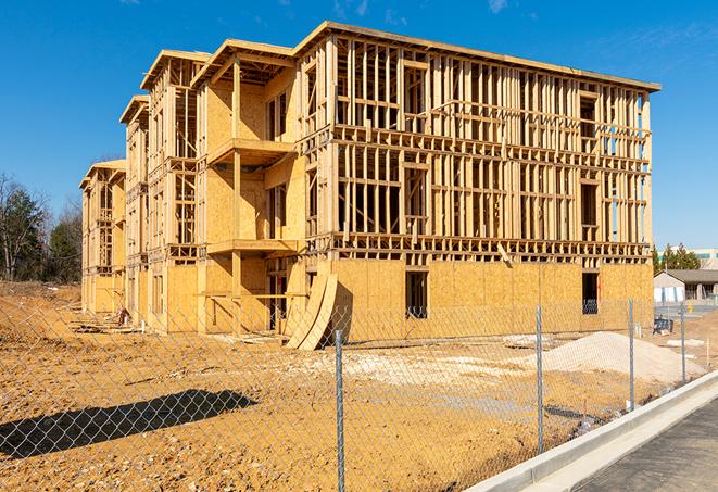 a snapshot of temporary chain link fences protecting a large construction project from unauthorized access in Aubrey TX